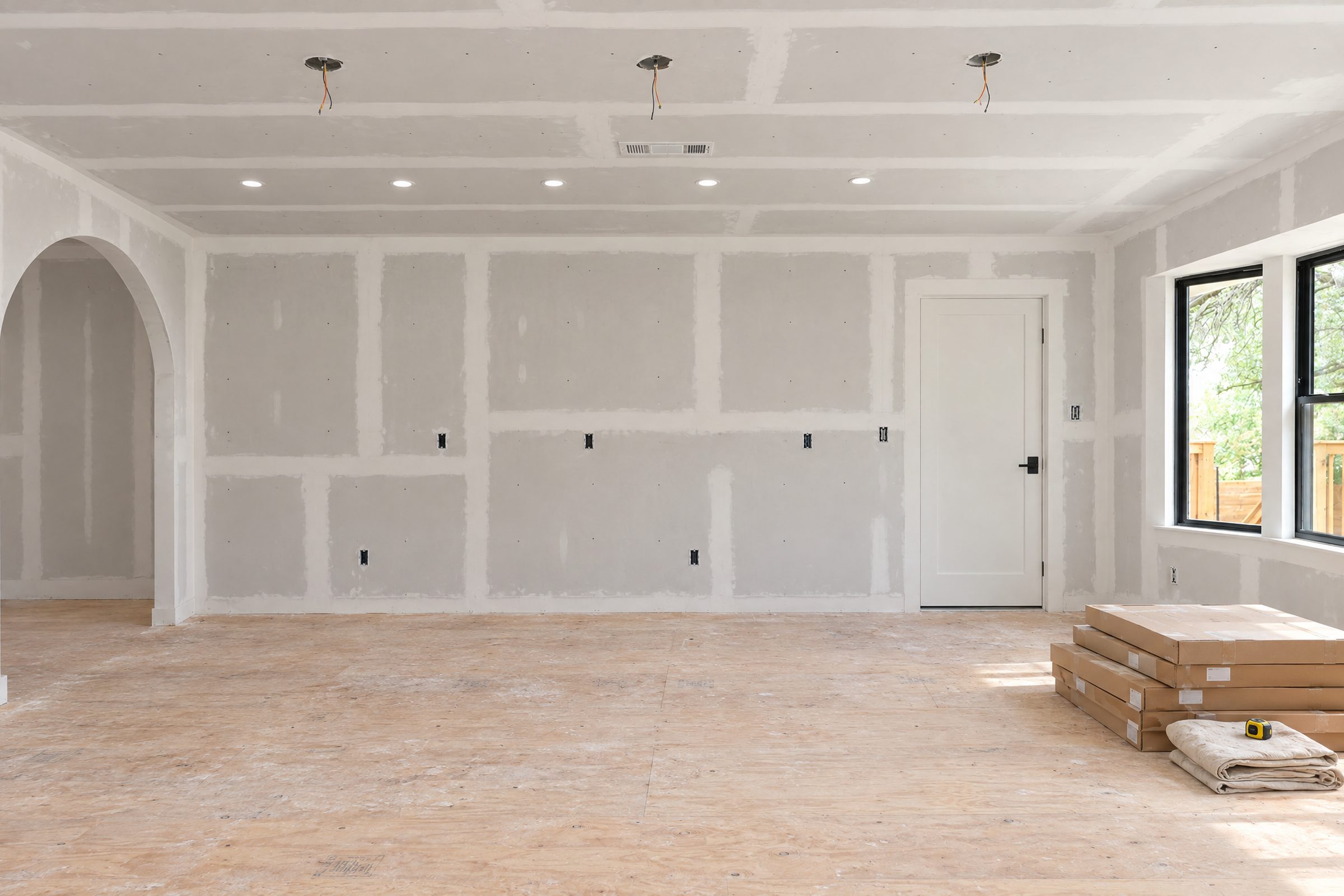 Kitchen space during renovation, cabinets still in flat boxes